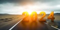 2024 New Year road trip travel and future vision concept. Nature landscape with highway road leading forward to happy new year Royalty Free Stock Photo