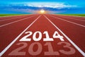 New Year 2014 on running track concept with sun & blue sky.