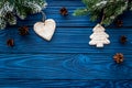 New year`s background. Christmas toys, spruce branches, pine cone on blue wooden background top view copyspace Royalty Free Stock Photo