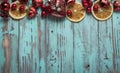 New year`s background on a light geen desk decorated with Christmas decoaration and candles. Bright colored Horizontal background