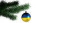 New Year`s ball with the flag of Ukraine on a Christmas tree branch isolated on white background. Christmas and New Year concept Royalty Free Stock Photo