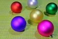 New Year`s balls for the Christmas tree on a green background.