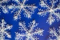 New Year`s blue background with white snowflackes Royalty Free Stock Photo