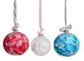 New Year\'s Christmas balls of pink blue white color on a white background isolated. Balloons hang on a ribbon with a bow. Royalty Free Stock Photo