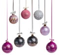 New Year\'s Christmas balls pink lilac black gold color on a white background. Balloons hang on a ribbon with a bow. Royalty Free Stock Photo