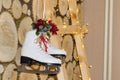 New Year`s and Christmas. Decorations in the form of real Skates for skiing against a background of rowan berries and a backgroun Royalty Free Stock Photo