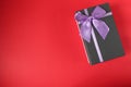 New year`s Christmas holiday mother`s day Valentine`s day birthday anniversary gift box black with purple purple fuchsia colors wi Royalty Free Stock Photo