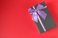 New year`s Christmas holiday mother`s day Valentine`s day birthday anniversary gift box black with purple purple fuchsia colors wi Royalty Free Stock Photo