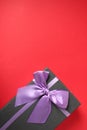 New year`s Christmas holiday mother`s day Valentine`s day birthday anniversary gift box black with purple purple fuchsia colors wi Royalty Free Stock Photo
