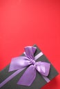 New year`s Christmas holiday mother`s day Valentine`s day birthday anniversary gift box black with purple purple fuchsia colors wi Royalty Free Stock Photo