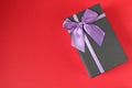 New year`s Christmas holiday mother`s day Valentine`s day birthday anniversary gift box black with purple purple fuchsia colors wi Royalty Free Stock Photo