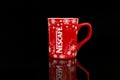 New Year\'s Christmas red branded cup with Nescafe logo and snowflakes Royalty Free Stock Photo