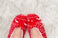 New Year`s, Christmas slippers for adults are dressed for the women. On white soft fur. Funny, funny, humorous, cozy, Royalty Free Stock Photo