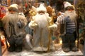 New Year`s and Christmas. Three Santa Claus in the shop window o