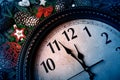 New Year`s clock shows five to midnight and decorations