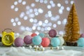 New Year\'s composition. Alarm clock. Bokeh. Multi-colored balls