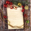 New Year\'s composition with a craft paper sheet and Christmas decor, Christmas tree branches, golden garland. Royalty Free Stock Photo