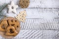 New Year`s composition. Gingerbreads and Christmas decorations on a white wooden background. Christmas, winter, new year concept.
