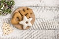 New Year`s composition. Gingerbreads and Christmas decorations on a white wooden background. Christmas, winter, new year concept.
