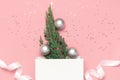 New Year`s composition, winter decoration. Silver Christmas toy balls, holiday ribbons, christmas tree branches white gift bag on Royalty Free Stock Photo