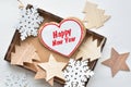 Heart shaped gingerbread cookies in wooden box, wooden fir-tree, snowflacke and star shapes Royalty Free Stock Photo