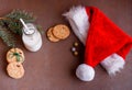 New Year`s content with baked cookies, milk, gifts, toy for the Christmas tree, Christmas tree twigs, view from above. Place for Royalty Free Stock Photo