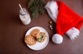 New Year`s content with baked cookies, milk, gifts, toy for the Christmas tree, Christmas tree twigs, view from above. Place for Royalty Free Stock Photo