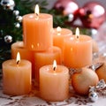 New Year\'s decor with candles and Christmas decorations in apricot crush color. Jewelry in delicate shades for the holiday