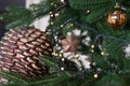 New Year& x27;s decor in a photo studio in gray and white colors. A snow-white tree, gifts and lanterns, defocus. sofa