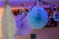 New year`s decoration with lamps and paper rosettes