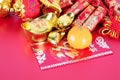 New Year`s decorations and red envelopes and oranges.The Chinese characters in the picture mean `make more money` and `happiness` Royalty Free Stock Photo