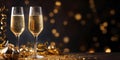 New Year\'s eve celebration banner with champagne glasses and golden confetti on black background Royalty Free Stock Photo