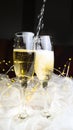New Year\'s Eve champagne glasses with chain lights and tulle