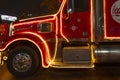 A New Year\'s Eve, Christmas Eve, Santa Claus Coca-Cola van drives through the evening city Austria, Vienna, December