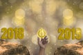 New Year`s Eve 2018, Finger Touch Starting 2019 Brightness Theme of Gold, 2019 happy new year with sparkling golden light bokeh Royalty Free Stock Photo