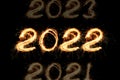 New Year`s Eve 2022 of sparklers on a black background. Years Counting Royalty Free Stock Photo