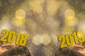 New Year`s Eve 2018 and Starting 2019 Brightness Theme of Gold,happy new year with sparkling golden light bokeh and glittering Royalty Free Stock Photo