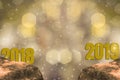 New Year`s Eve 2018 and Starting 2019 Brightness Theme of Gold,happy new year with sparkling golden light bokeh and glittering Royalty Free Stock Photo