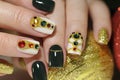 New year`s fashionable beautiful festive manicure on short square nails with green lacquer color.