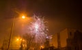 New Year`s fireworks create smoke over houses on the outskirts of the city - Long exposure at night on New Year Royalty Free Stock Photo