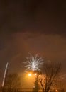 New Year`s fireworks create smoke over houses on the outskirts of the city - Long exposure at night on New Year Royalty Free Stock Photo