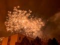 New Year`s fireworks create smoke over houses on the outskirts of the city - Long exposure at night on New Year Royalty Free Stock Photo