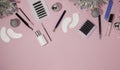 New year`s flatley. Tools for eyelash extension on a pink background, top view. Patches, artificial eyelashes, brushes, glue,