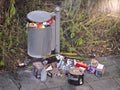 New YearÃ¢â¬â¢s garbage. Fireworks batterys next to a trash can on the footpath