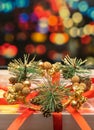 New Years gift on the background of multi-colored blurred background. christmas present Royalty Free Stock Photo