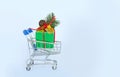 New Year's gifts in a basket on a white background Royalty Free Stock Photo