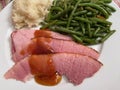 New Year\'s Ham Dinner With Mashed Potatoes and Green Beans Royalty Free Stock Photo