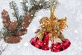 New Year`s hand bell on a fir-tree branch with cones. Christmas Background Royalty Free Stock Photo