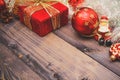 New Year`s holiday decor on a wooden table.Santa Claus and red balls