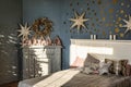 New Year`s interior. Bedroom with fireplace decorated with Christmas stars. Sweet home Royalty Free Stock Photo